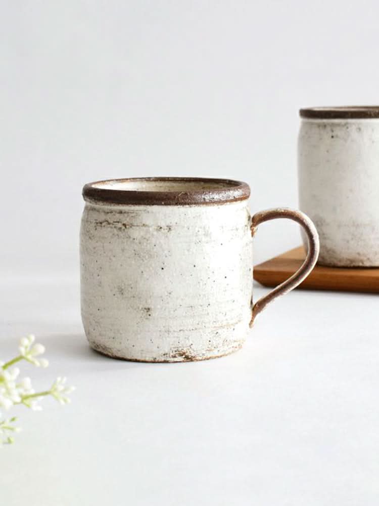 White glazed ceramic mug with a rustic finish, part of the Clay Ceramic Dinnerware Set.
