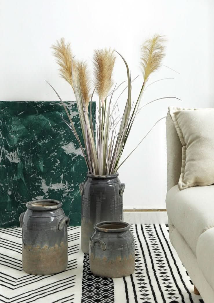 Double-Eared Stoneware Vase with dried pampas grass, in a modern living room setting.
