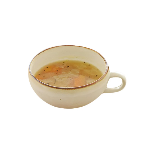 Japan Imported Minoyaki white ceramic soup cup filled with light soup.