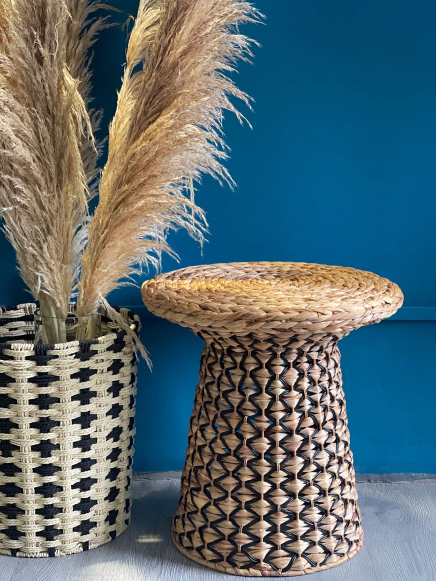 Wabi Sabi Coffee Table made of woven straw and natural fibers, with a textured basket and dried pampas grass.