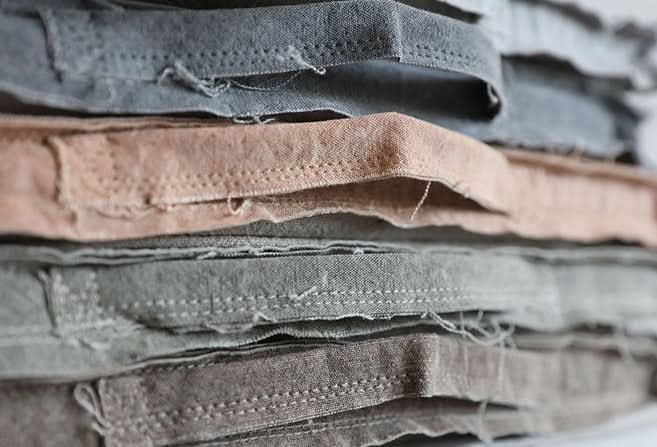 Customizable distressed linen cushion swatches in grey, beige, and taupe.