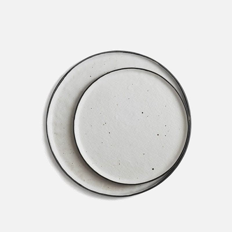 Flat Stoneware Speckled Plate: white ceramic with black speckles and rim, Nordic kitchenware.