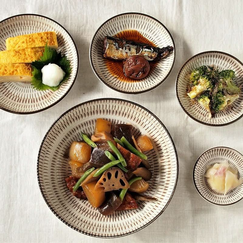 Spiral Ceramic Tableware Set Made in Japan: Traditional Japanese dishes served on decorative ceramic plates.