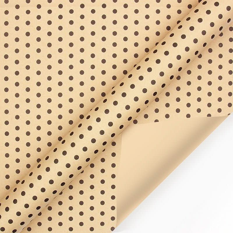 Kraft paper gift wrap with brown polka dots.