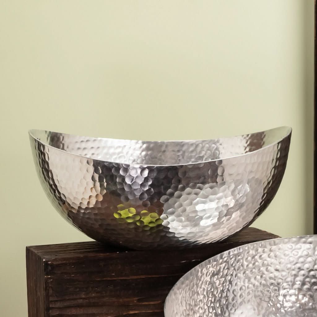 Handcrafted 12" Hammered Stainless Steel Centerpiece Bowl on dark wood.