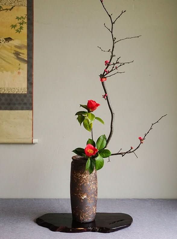 Handmade Japanese kiln glazed vase with red flowers and branches, Zen home decor.