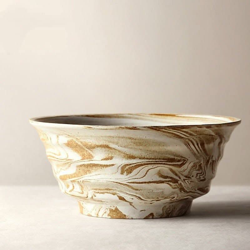 Ceramic ramen bowl with a unique brown and white marble effect, 47oz capacity, in a home decor setting.