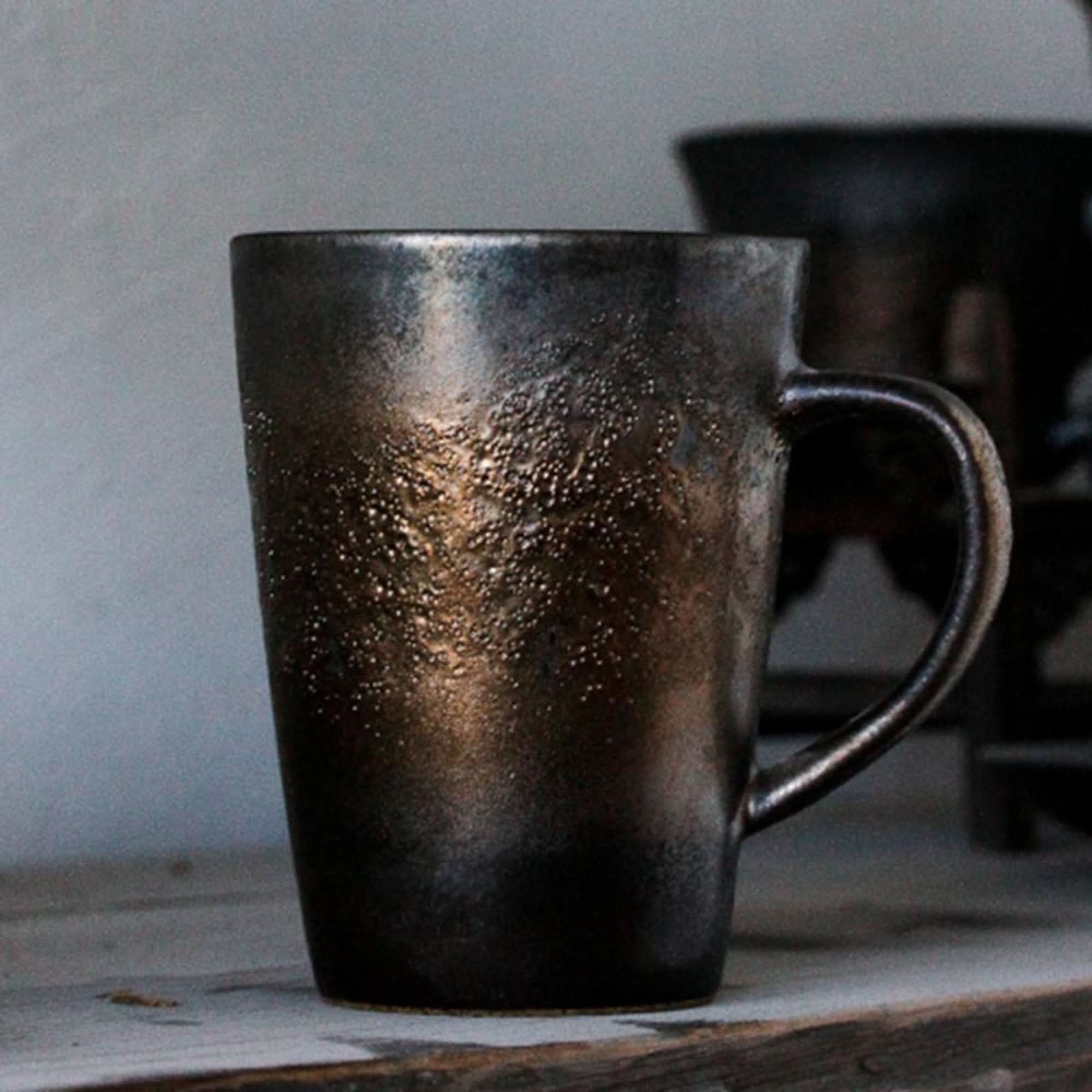 Large handmade pottery mug with metallic glaze and retro Japanese style.