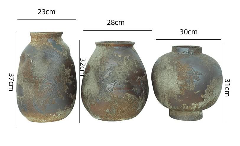 Handmade stoneware rounded irregular pottery ceramic vases in retro, wabi-sabi style.