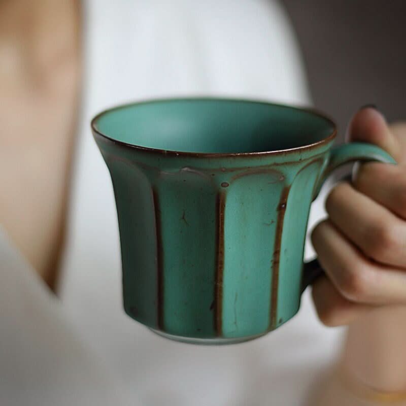 Handmade stoneware coffee mug in speckled teal with vertical pattern. Nordic, Japanese, rustic.