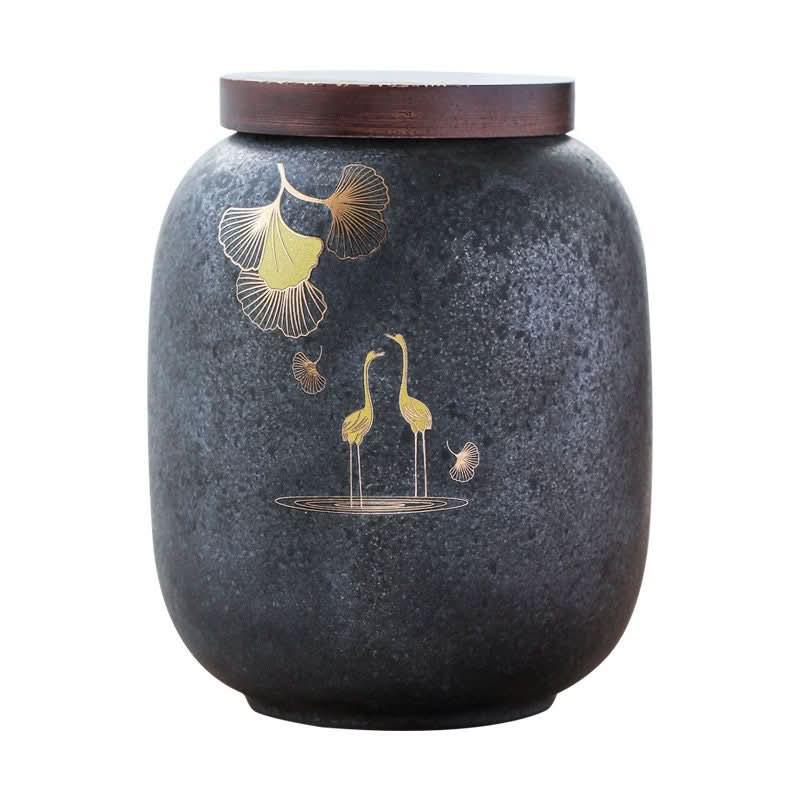 Dark gray ceramic tea caddy with cranes and gingko leaves, wooden lid. Airtight storage jar.