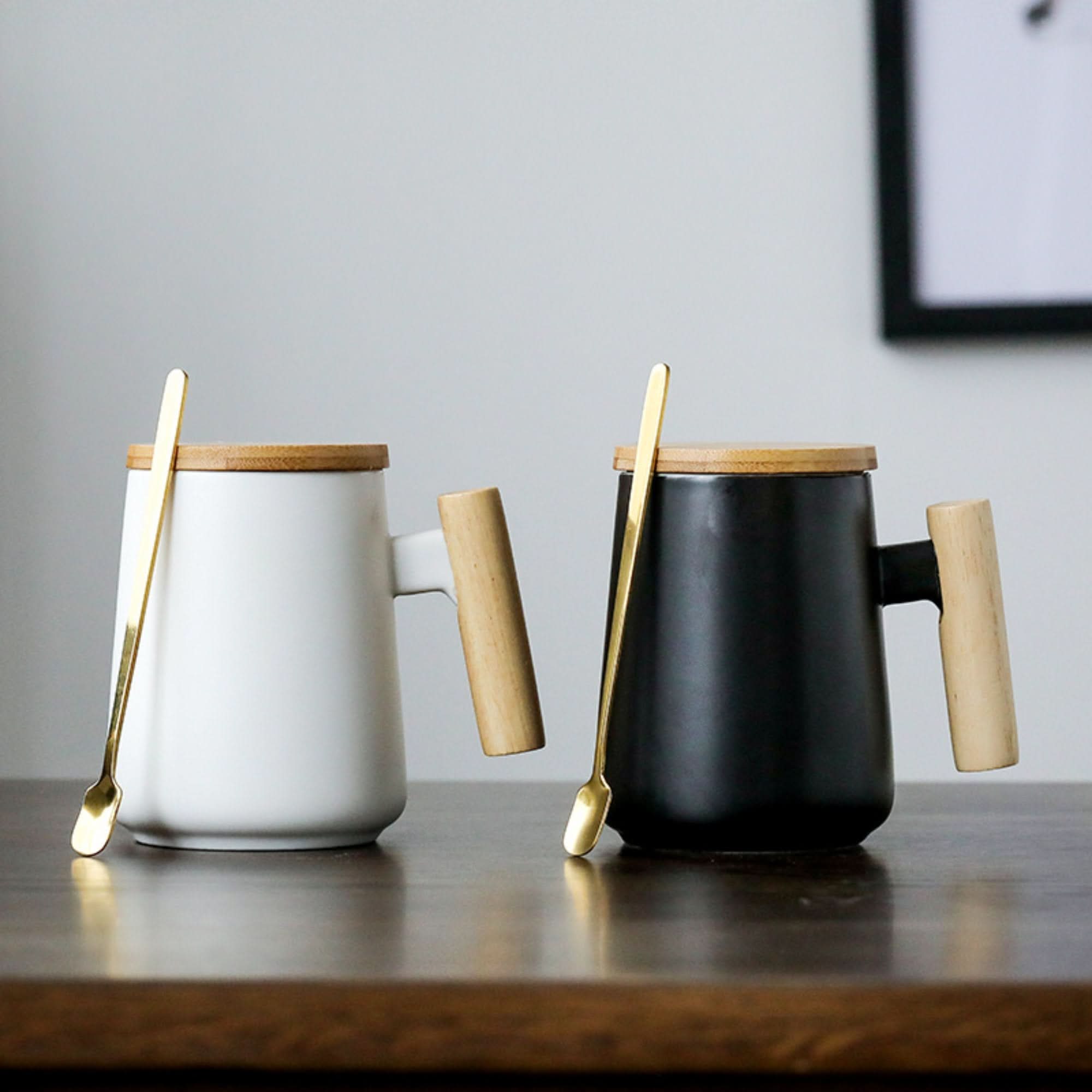 Minimalist Japanese Latte Mug 480ml in white and black with wood handle and gold spoon.