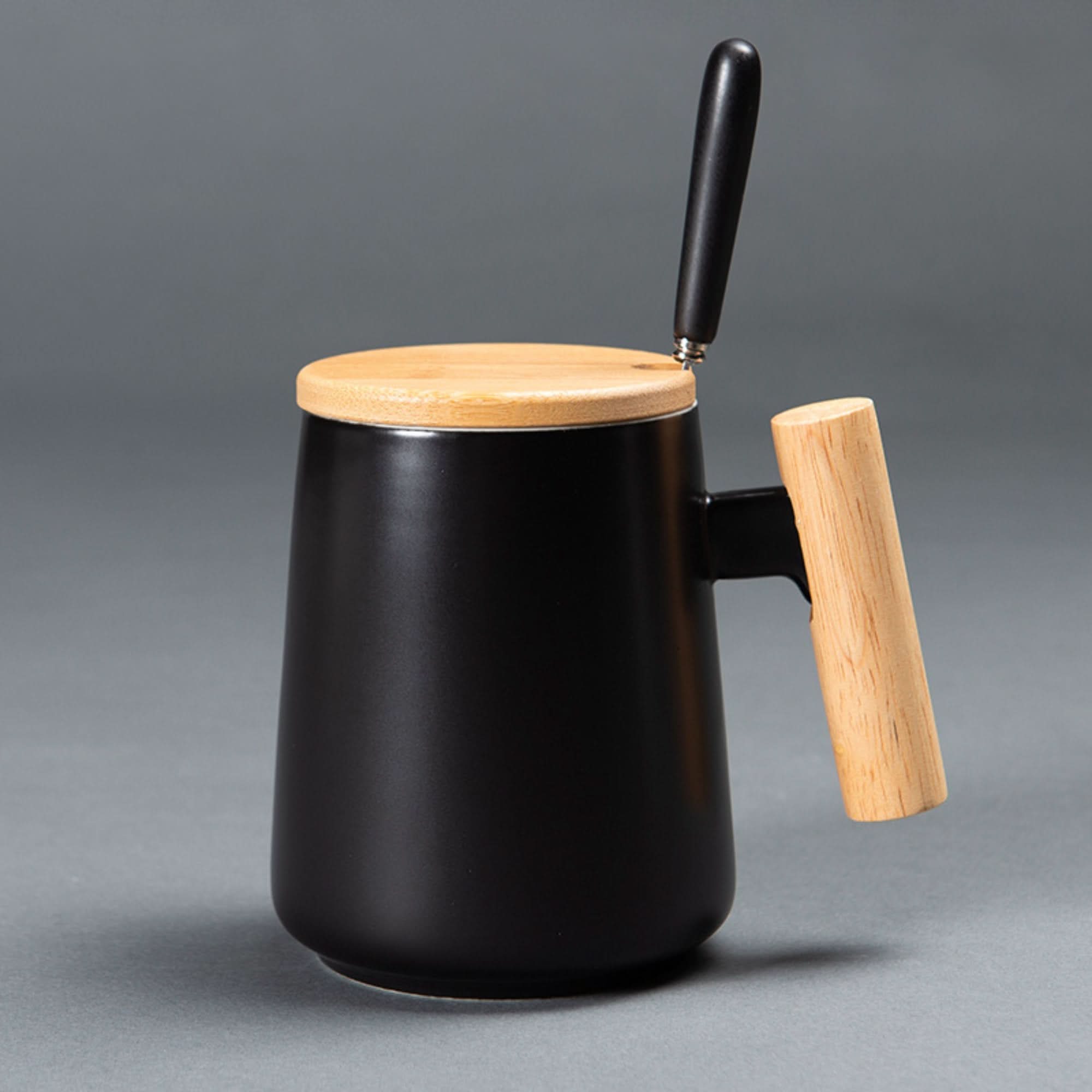 Black Japanese style minimal coffee mug with wooden lid, handle, and spoon. 480ml.