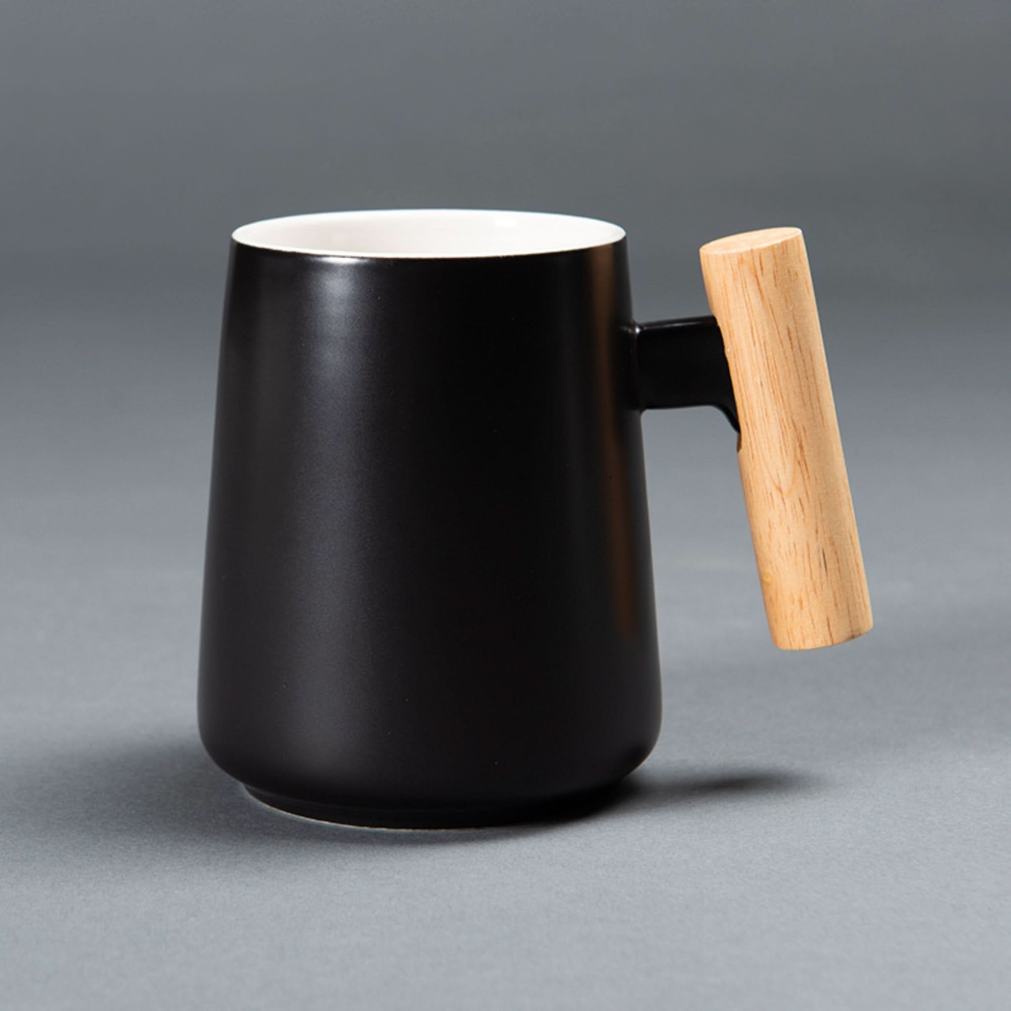 Minimal black ceramic coffee mug with wooden handle, Japanese style latte mug.