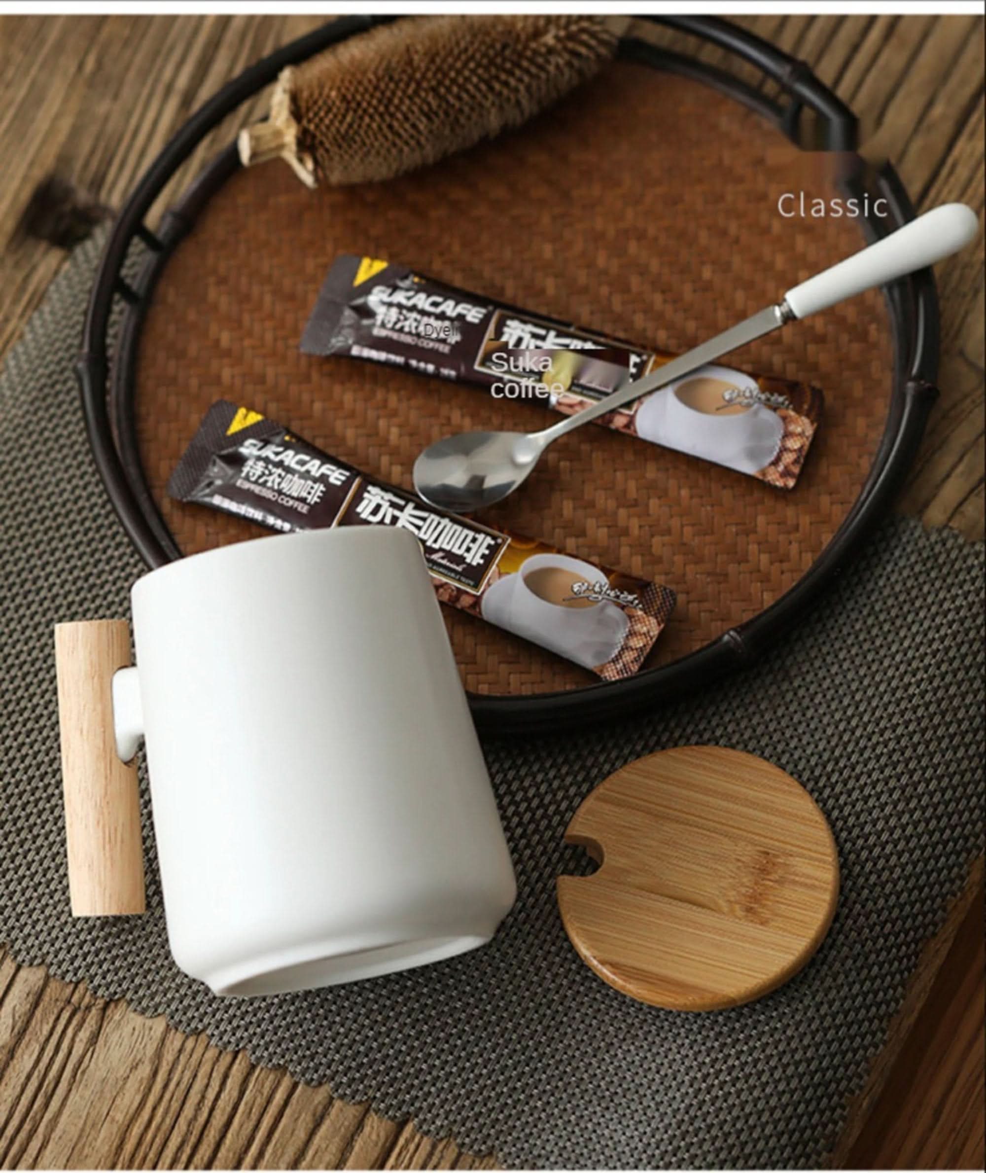 Minimal Japanese style white coffee mug with wood handle, 480ml. Includes coffee sachets.