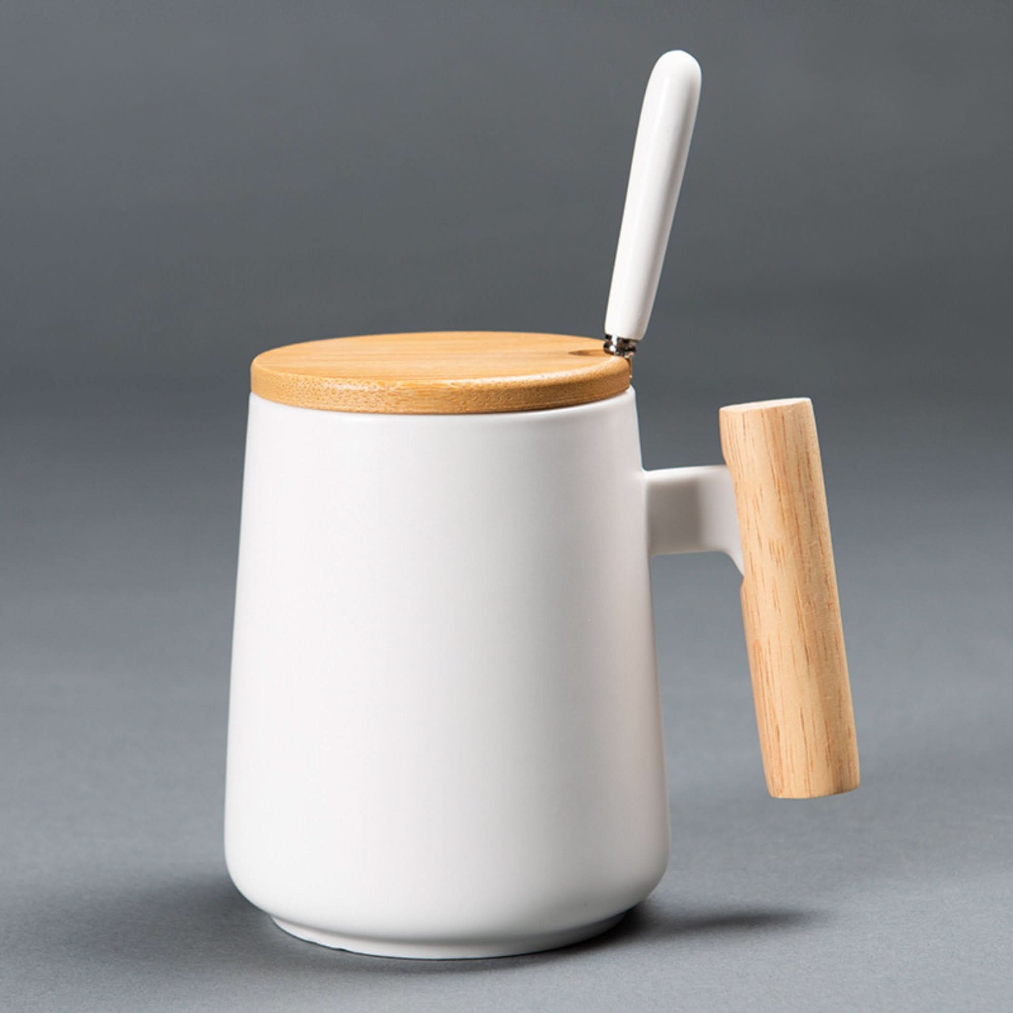 Minimal Japanese style white coffee mug with wood handle and bamboo lid.