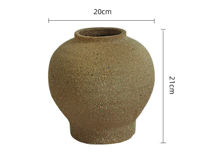 Rustic, rounded ceramic vase;  gray-brown;  hand-made;  plant pot.