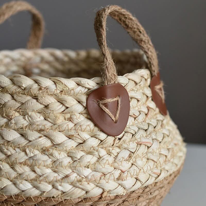 Natural straw plant flower pot with jute handles and brown leather accents