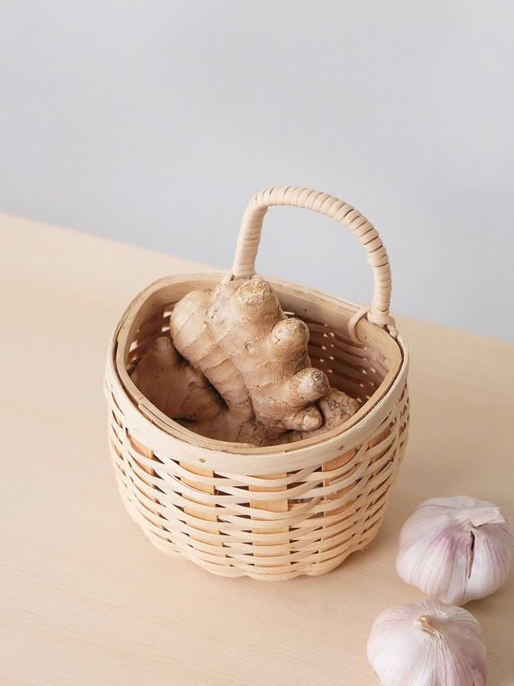 Rattan clear wood kitchen basket with ginger. Fruit, vegetable, storage.