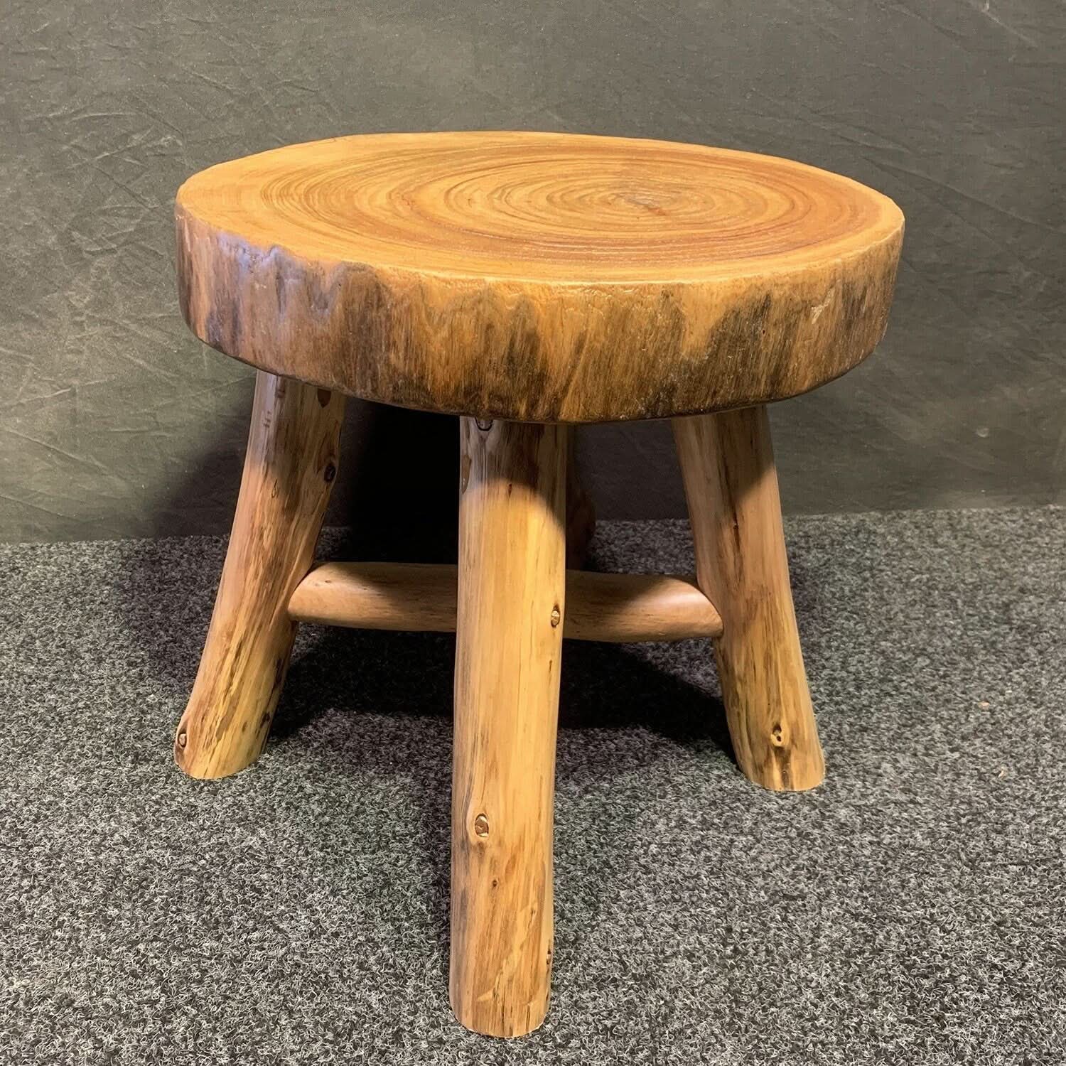 Natural Solid Wood Tree Ring Stool on textured gray carpet.