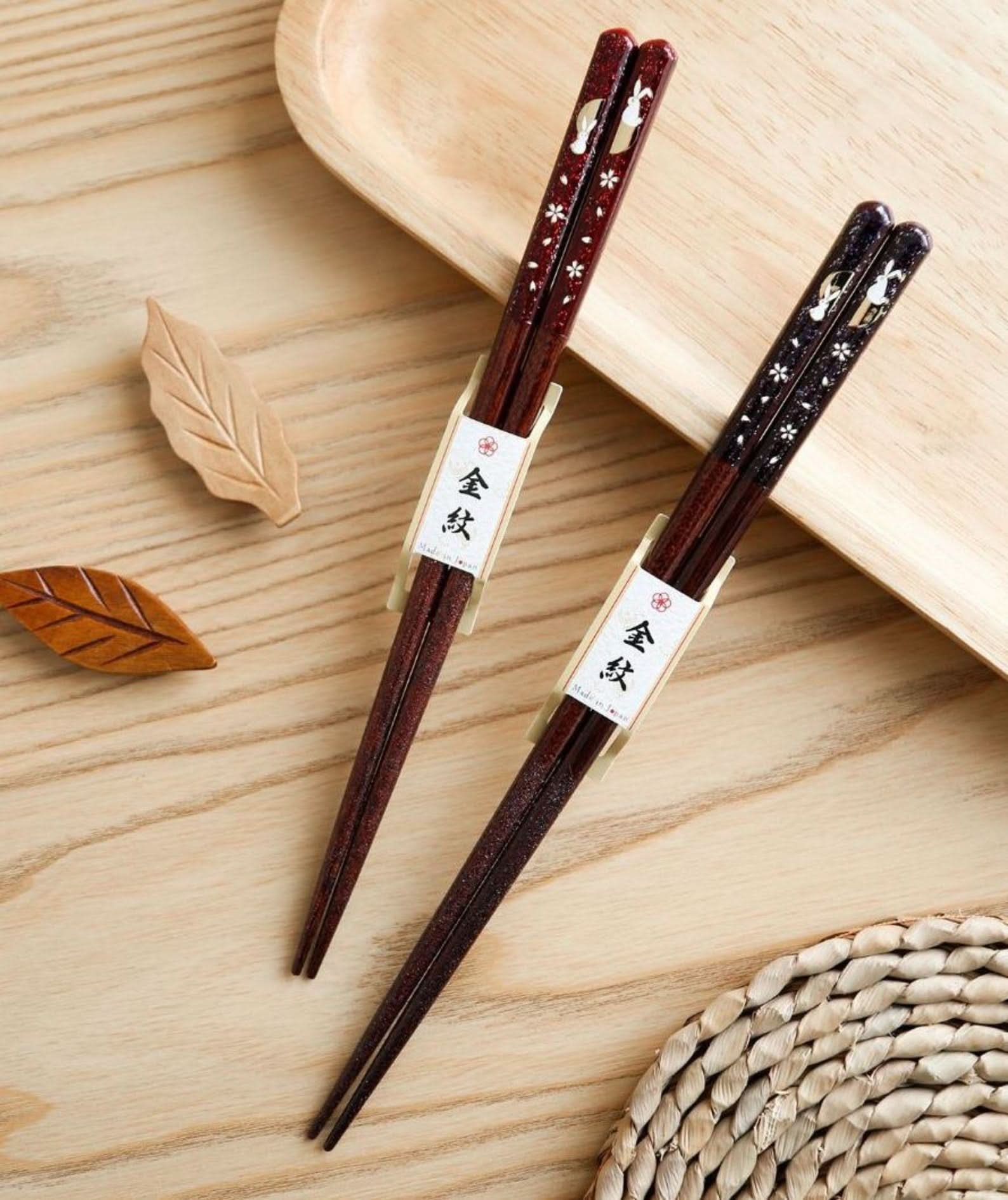 Japanese Cherry Rabbit solid wood chopsticks, handcrafted with floral & bunny design, on wooden surface.