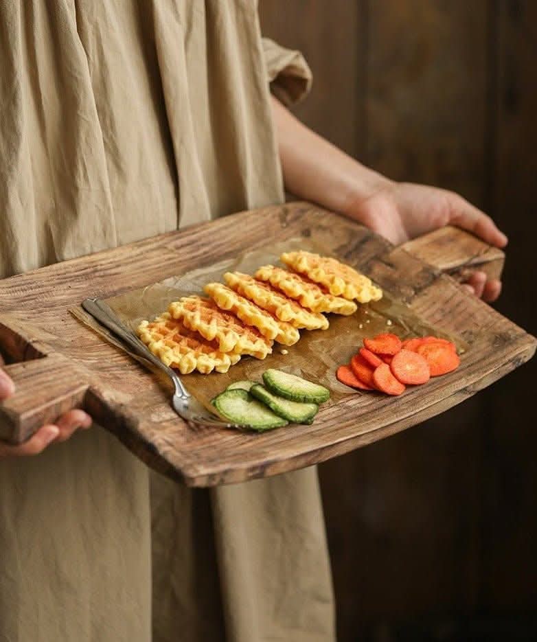 Irregular Rectangular Wooden Serving Tray with waffles, avocado, and carrots on a beige cloth.