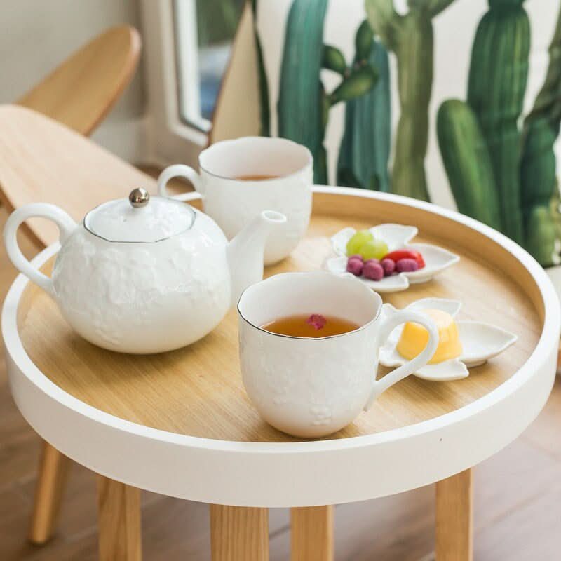 Irregular Wabi-Sabi Tea Set: White ceramic teapot & cups with grape engraving on wooden tray.
