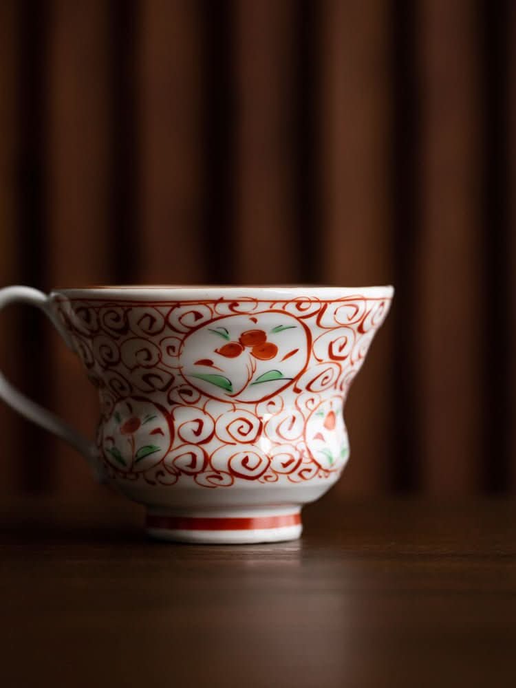 Japan Imported Bloom Red-painted Cherry Branch Mug with red floral design on white ceramic.