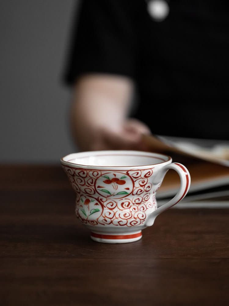 Japan Imported Bloom Red-painted Cherry Branch Mug, white ceramic with red & green floral design.