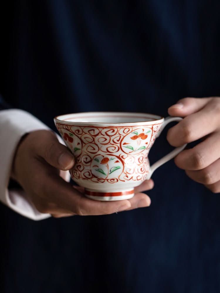 Japan Imported Bloom Red-painted Cherry Branch Mug, white ceramic with red floral detail.