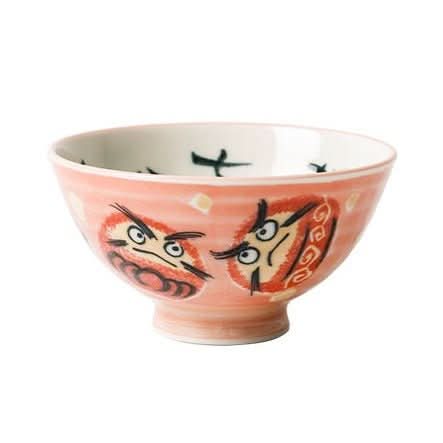 Pink ceramic Japanese bowls with illustrated daruma dolls and brushstroke accents.