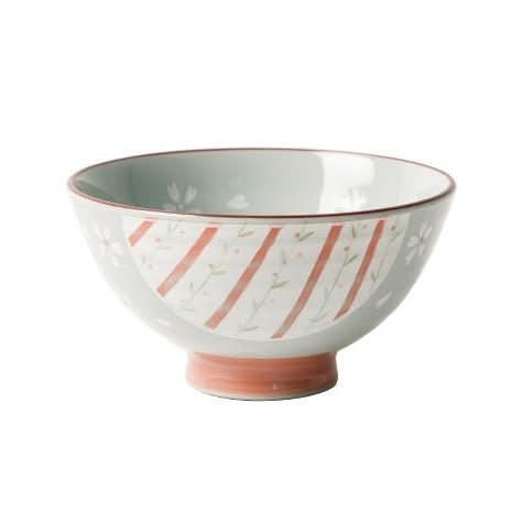 Light green ceramic Japanese bowl with coral stripes and floral illustrations.