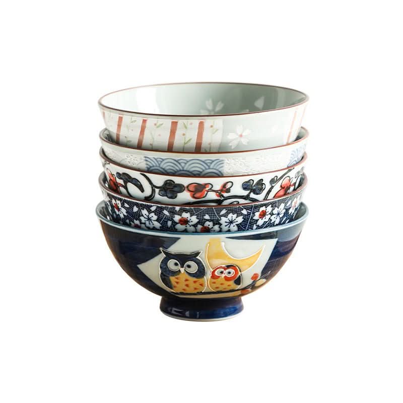 Stack of Japanese bowls with owl and floral illustrations, ceramic, home decor.