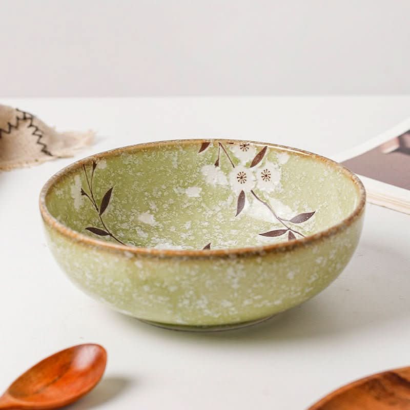 Japan imported green cherry ceramic shallow bowl with floral design.