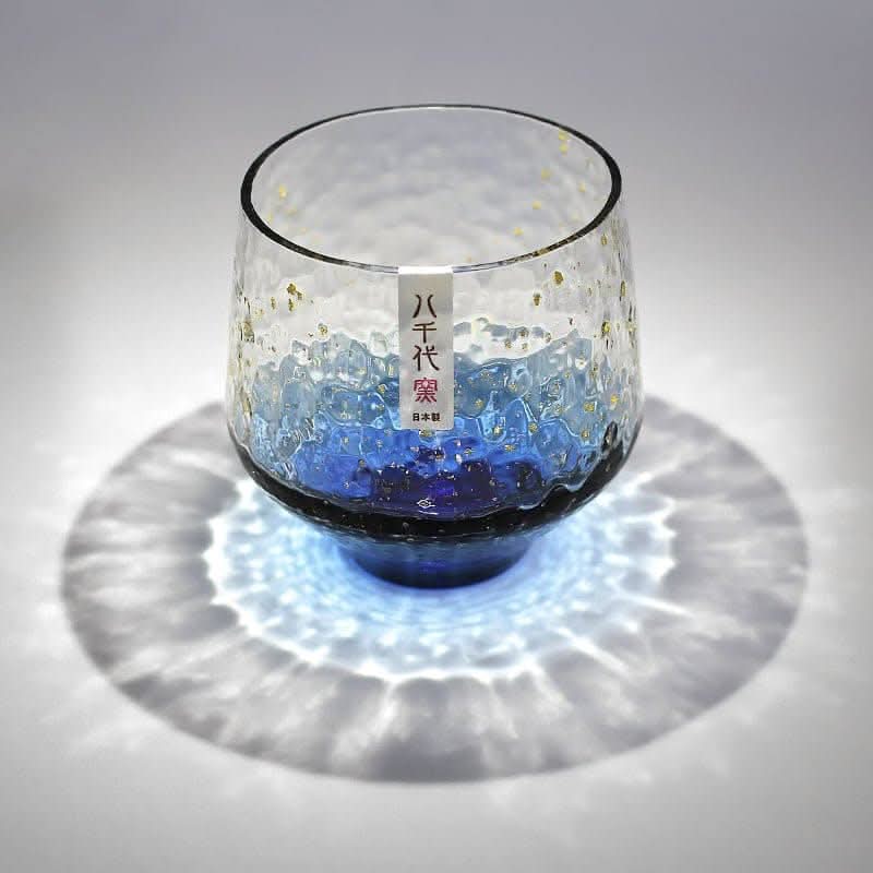 Japan Imported Hand-Made Colored Glass Cup, blue ombre with gold flecks, textured, casts rippling light.