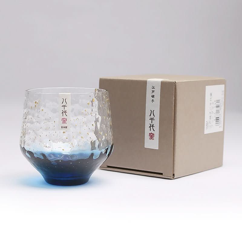 Japan Imported Hand-Made Colored Glass Cup: blue & white textured glass with gold flecks.