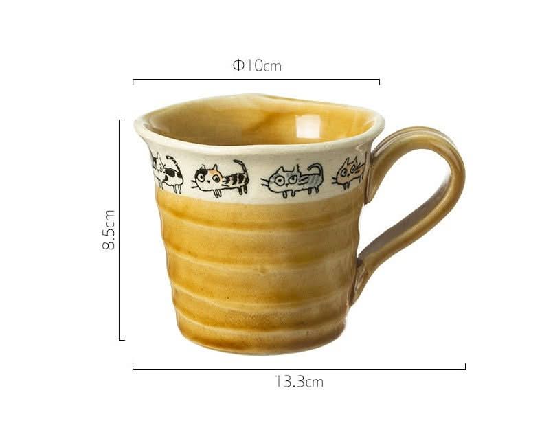 Japan imported handmade screw shaped cat mug, ceramic, amber glaze, with cat illustrations