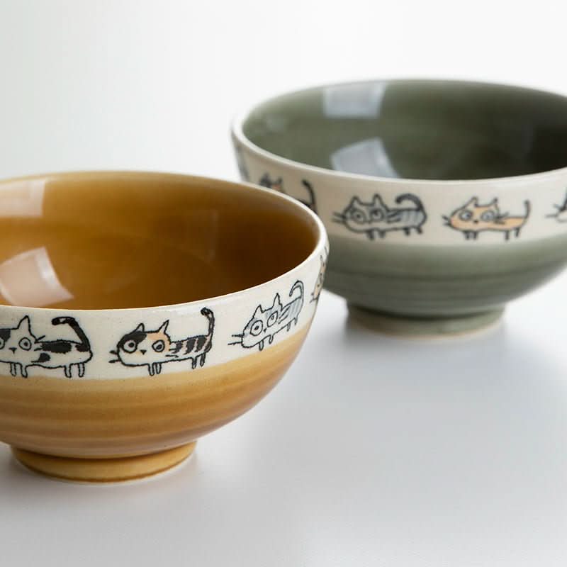 Japan imported hand made screw shaped cat mug, featuring two ceramic bowls with playful cat designs.