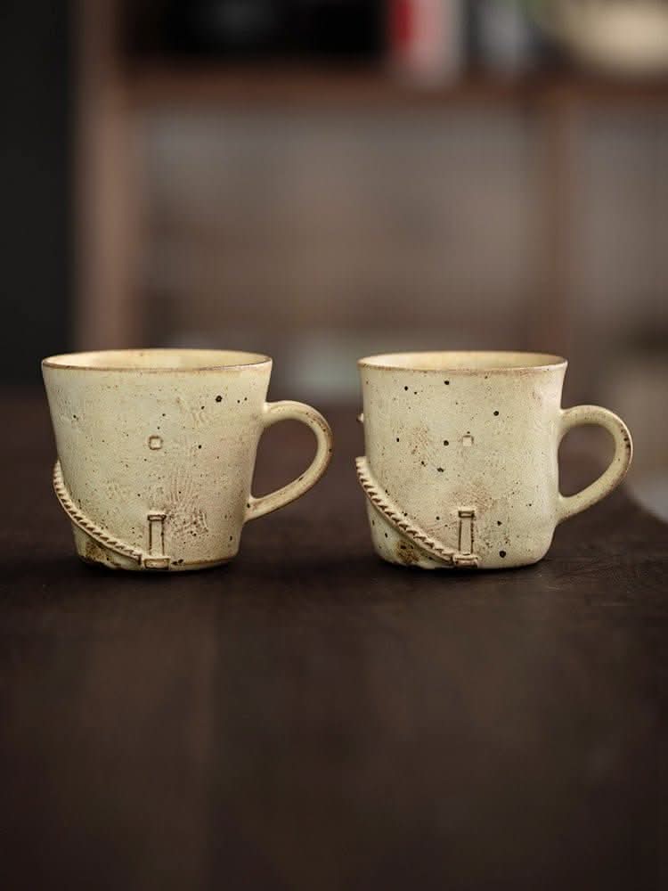 Two Japan imported stoneware Lighthouse Mugs, handmade with speckled cream finish.