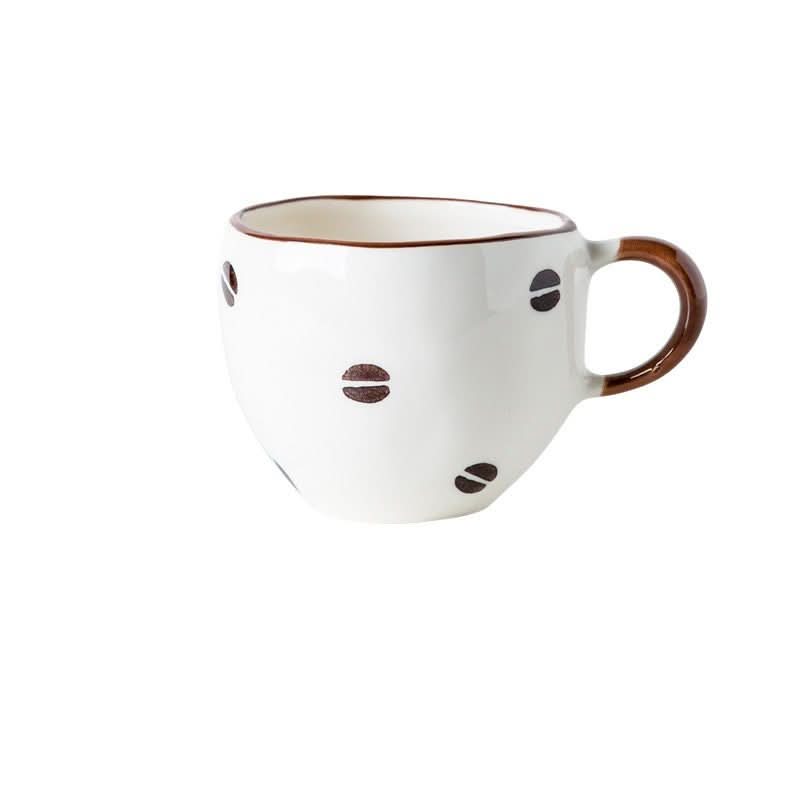 White ceramic coffee cup with brown coffee bean pattern, 8.45oz. Japan imported.
