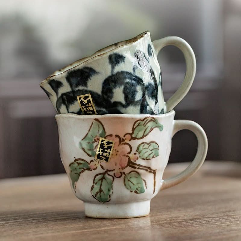 Japan Imported Mino Burning Tang Grass Cherry Blossom 8.45oz ceramic cups with hand-painted designs.