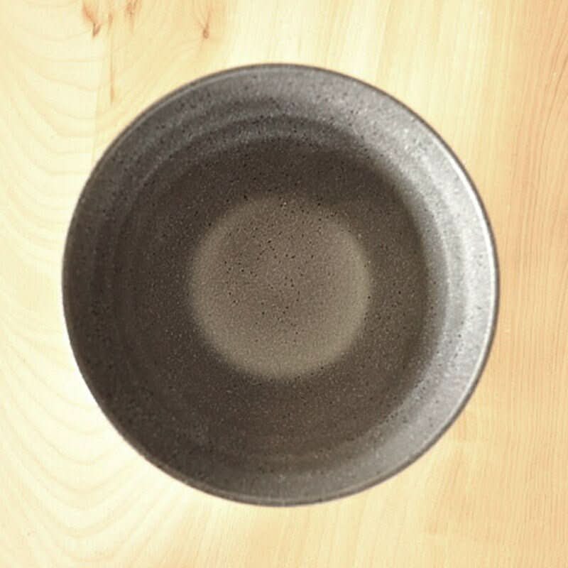 Japan Imported Mino-Yaki Ceramic Bowl Set: Dark speckled ceramic rice bowl on wood.