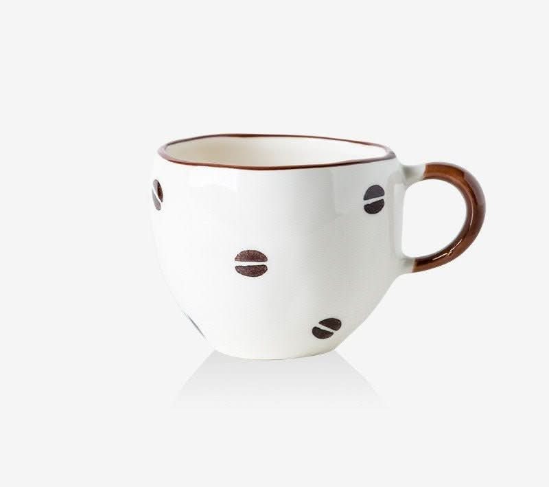 Japan Imported Mino Yaki Ceramic Coffee Cup 10.14oz, white with brown coffee bean pattern.