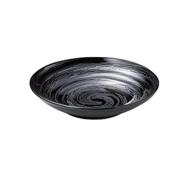 Japan Imported Mino yaki deep dish: black ceramic with underglaze swirl pattern.
