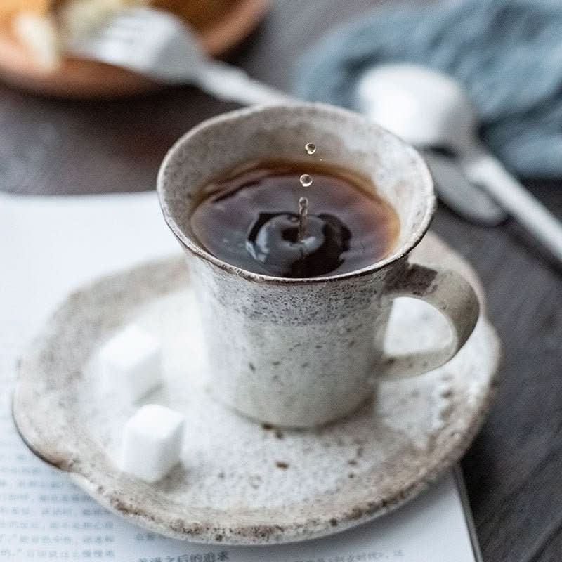 Japan Imported Mino Yaki Tea Powder Lead Set Cup, handmade ceramic mug with dark tea and sugar cubes.