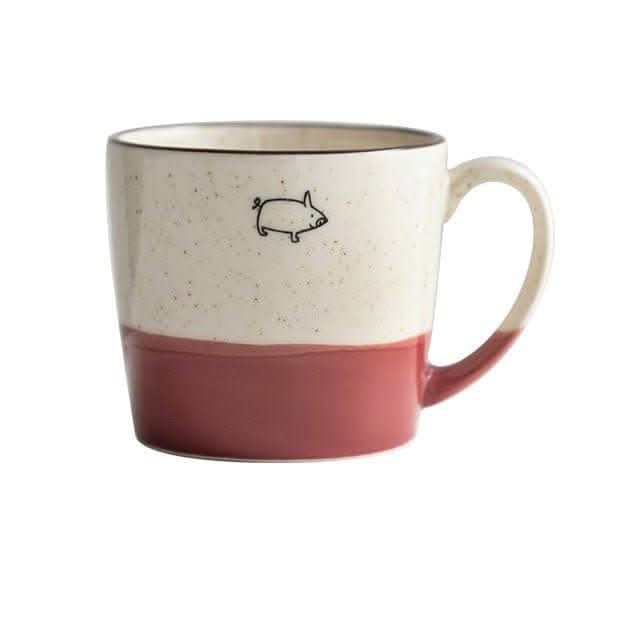 Japan imported Minoyaki ceramic mug with cute pig illustration, two-tone red and cream.