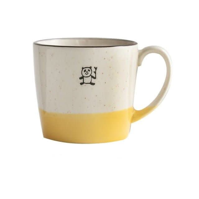 Japan imported Minoyaki mug with cute panda design, white and yellow ceramic.