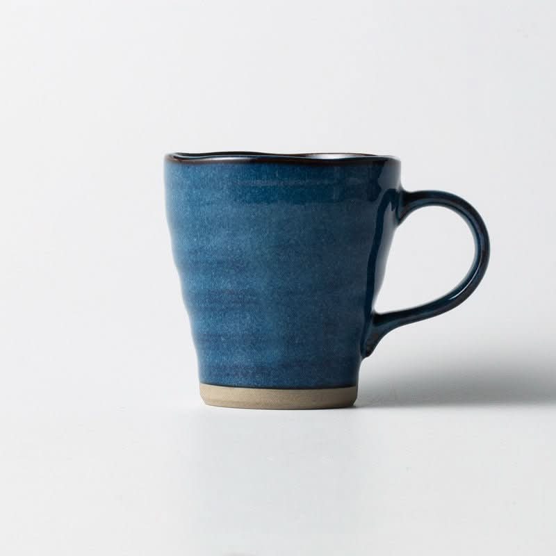 Japan imported Minoyaki ceramic mug, deep blue underglaze color, on white background.