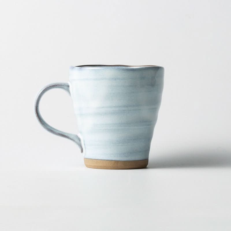 Japan Imported Minoyaki Ceramic Mug with underglaze blue and brown matte finish on white background.