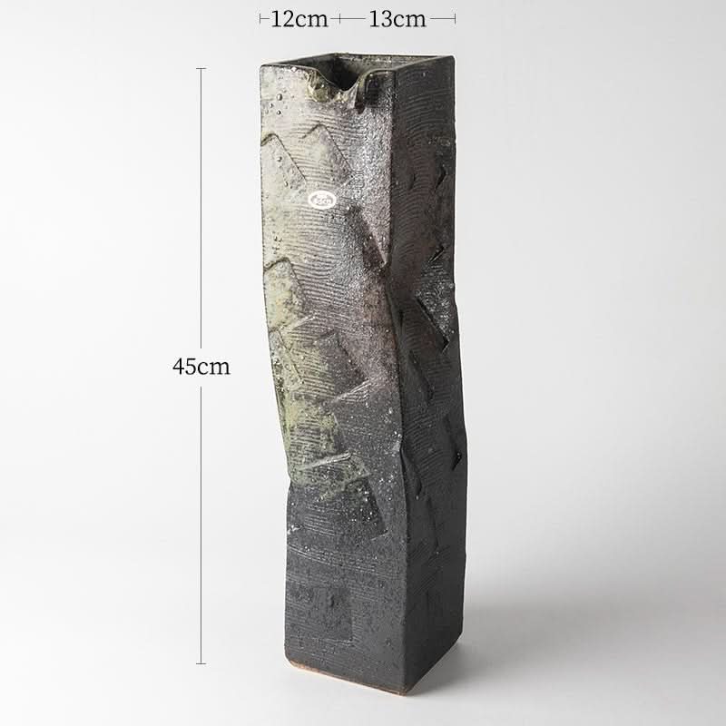 Tall, textured black Shigaraki ceramic flower arrangement imported from Japan.